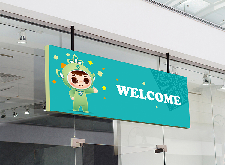 北医附小室内迎宾墙面导视设计，印有吉祥物形象与WELCOME英文欢迎语